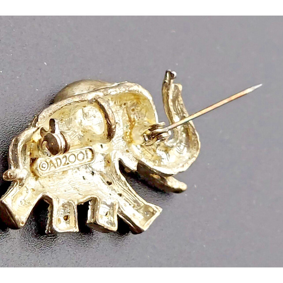 Vintage Rhinestone Elephant Brooch AD 2001 Red Eye Gold Tone Trunk Up Tusk Pin - Picture 9 of 11